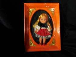 5'' UNKNOWN CIRCA 1970 BLONDE DOLL IN ORANGE PLASTIC FRAME